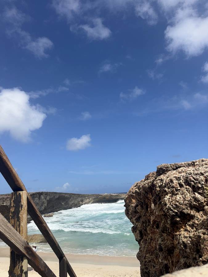 Where the surf meets the cliff.